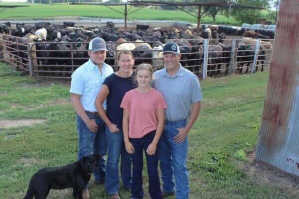 Knobloch Family standing in front of their herd