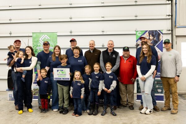 Poppe Farms family, Coalition to Support Iowa's Farmers The Good Neighbor Award, family photo in shed on family farm.
