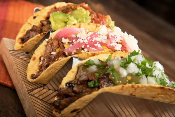 Flank Steak Carne Asada, flank steak, pickled onions, fresh onions, cilantro, tortillas, cheese.