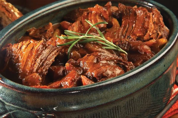 Easy Pot Roast, green pot with green rosemary leaves on top.